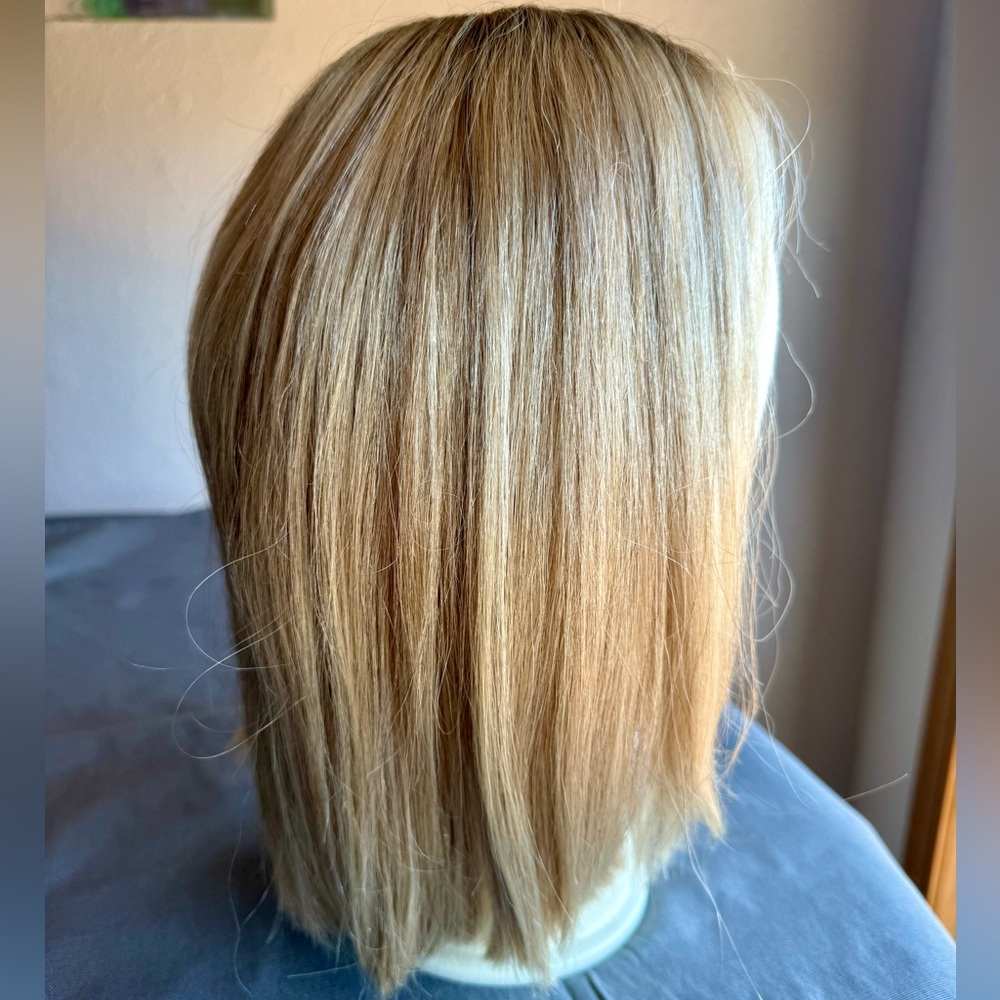 Uniwigs human hair topper “Courtney” in color Vanilla Butter blonde. 12” length.